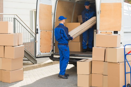 Man with a van service loading household items for transport