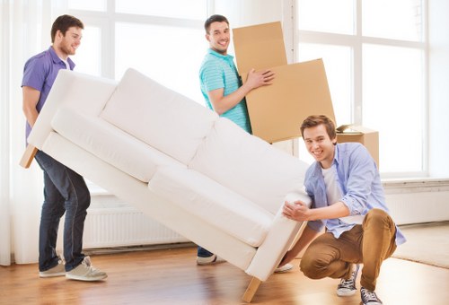 Removal van and moving boxes in a Chessington residential street