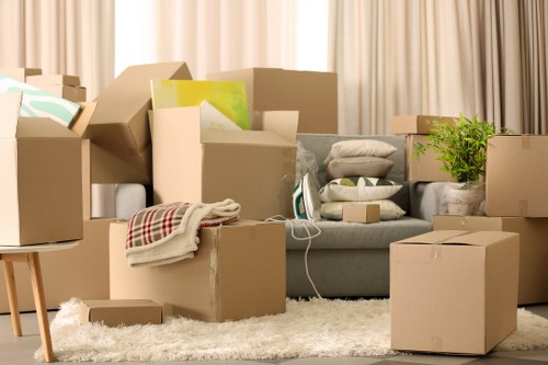 Professional movers loading furniture for an urgent Chessington relocation