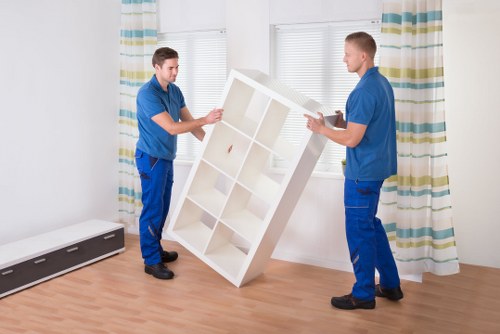 Furniture and boxes being loaded into a van