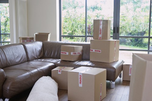 Packed boxes and furniture prepared for flat removals in Chessington